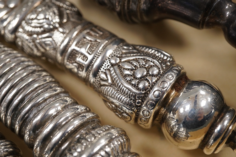 A pair of George V silver kiddush cups, maker M.S., London, 1919, 9cm, one other silver kiddush cup, two Judaic sterling tots, a set of eight Polish white metal tots, maker SJ, one other pair of Polish white metal tots,
